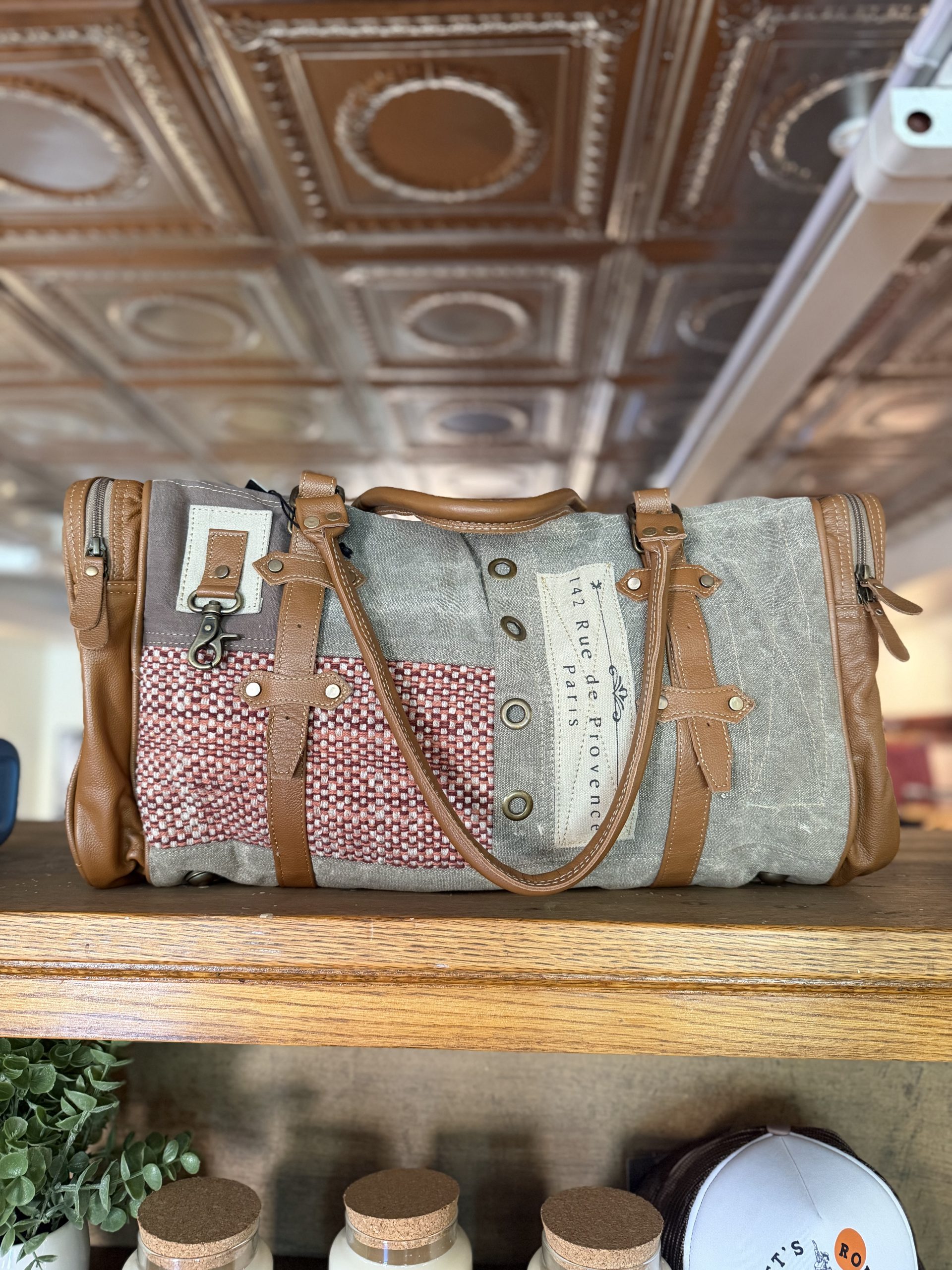 Canvas and leather weekender duffel bag with Paris travel label