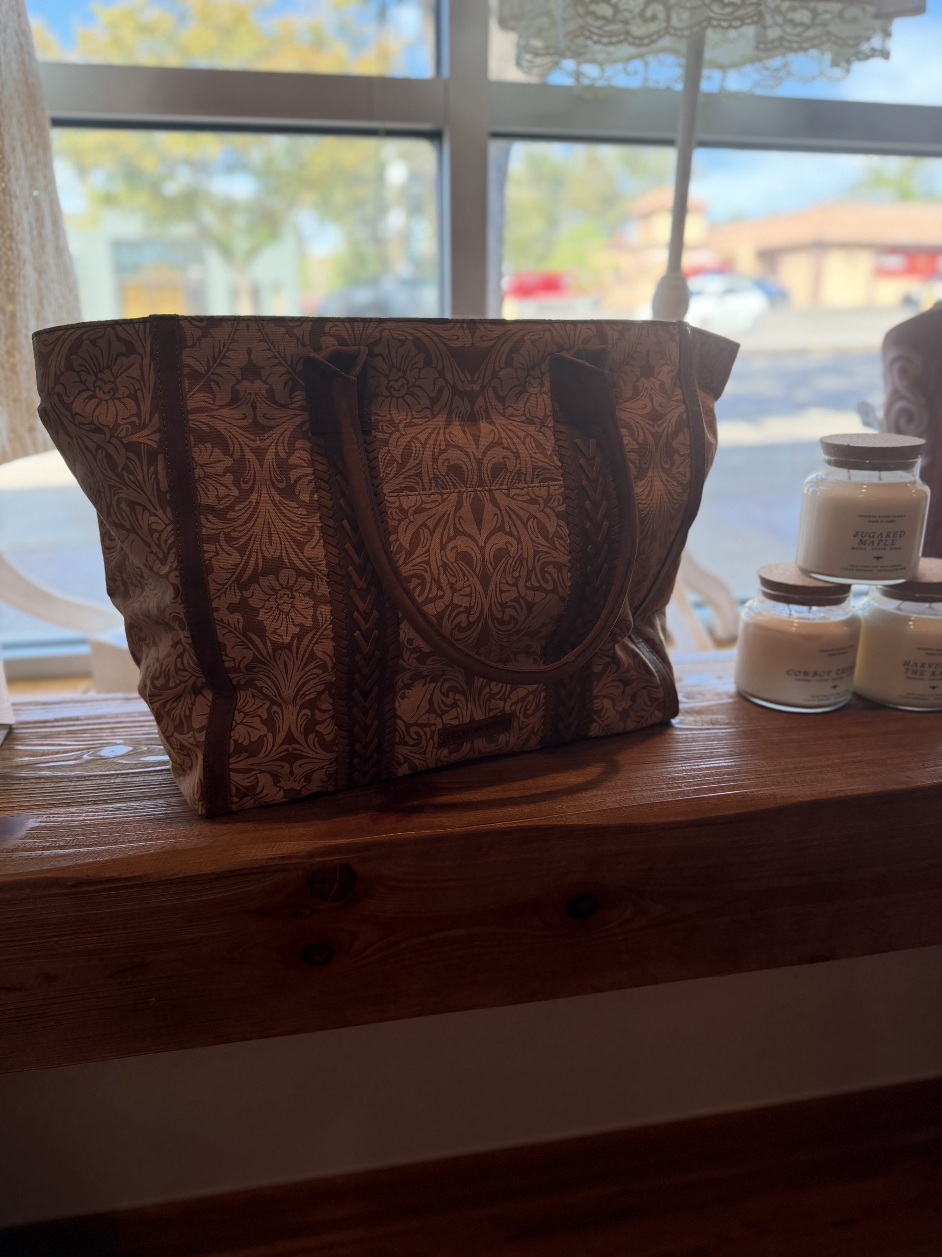 Damask print canvas tote with braided leather handles
